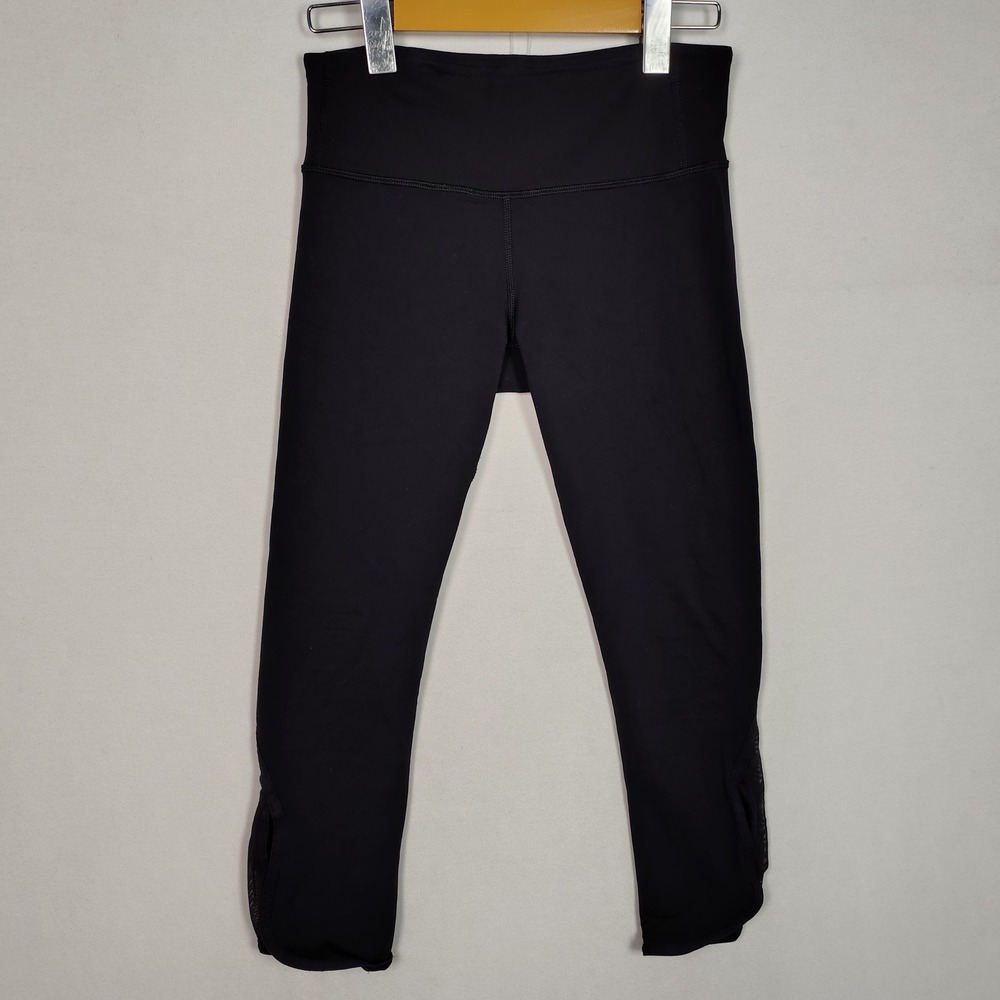 Lululemon Black Cropped Mesh Panel Leggings Zipper Pocket Tulip Hem 1533